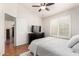 Guest bedroom with hardwood floors, a ceiling fan, and natural light at 3581 W Ironwood Dr, Chandler, AZ 85226