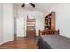 Well-lit bedroom with hardwood floors, a ceiling fan, and classic furnishings at 3581 W Ironwood Dr, Chandler, AZ 85226