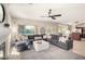 Spacious Gathering room with a large sectional sofa, fireplace, and views of the backyard at 3581 W Ironwood Dr, Chandler, AZ 85226