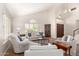 Bright living room with vaulted ceilings, plantation shutters, and comfortable seating at 3581 W Ironwood Dr, Chandler, AZ 85226