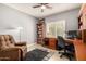Comfortable home office featuring a ceiling fan, built-in desk, and tile flooring at 3581 W Ironwood Dr, Chandler, AZ 85226