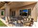 Cozy covered patio with comfortable seating, a fire pit, and serene outdoor views at 3581 W Ironwood Dr, Chandler, AZ 85226