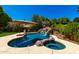 Inviting backyard features a private pool and hot tub, perfect for relaxation and entertaining at 3581 W Ironwood Dr, Chandler, AZ 85226