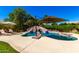 Private backyard pool with custom rock waterfall feature and lush landscaping at 3581 W Ironwood Dr, Chandler, AZ 85226
