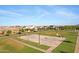Neighborhood basketball court and playground, with surrounding homes, trees, and lawns at 3929 E Bloomfield Pkwy, Gilbert, AZ 85296