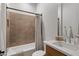 Bathroom with shower-tub combo with gray and cream color scheme and modern fixtures at 3929 E Bloomfield Pkwy, Gilbert, AZ 85296