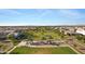 Overhead view of a neighborhood park with a playground, shaded picnic areas, and green lawns at 3929 E Bloomfield Pkwy, Gilbert, AZ 85296