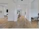 Bright and airy hallway with hardwood floors leading to the living area at 3929 E Bloomfield Pkwy, Gilbert, AZ 85296