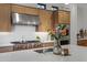 Close-up of kitchen island featuring a sink, oven and bouquet of flowers at 3929 E Bloomfield Pkwy, Gilbert, AZ 85296