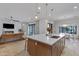 Spacious kitchen island with seating, pendant lighting, and a sink, perfect for entertaining and food preparation at 3929 E Bloomfield Pkwy, Gilbert, AZ 85296