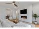Spacious living room featuring a modern fireplace, sleek TV, and comfortable seating at 3929 E Bloomfield Pkwy, Gilbert, AZ 85296