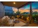 Cozy covered patio with comfortable seating and string lights at 3929 E Bloomfield Pkwy, Gilbert, AZ 85296