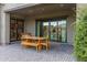 A covered patio featuring a dining table with chairs and a seamless transition to the indoor living space at 3929 E Bloomfield Pkwy, Gilbert, AZ 85296