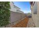 Narrow side yard with mulch, stones, and pavers lining the walkway at 3929 E Bloomfield Pkwy, Gilbert, AZ 85296