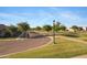 Scenic street view with tree-lined sidewalks and well-maintained landscaping in a quiet residential neighborhood at 3929 E Bloomfield Pkwy, Gilbert, AZ 85296