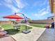 Beautiful backyard featuring a pool, patio area, lush landscaping, and desert views at 4132 W Tunnel Mine Rd, New River, AZ 85087