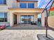 Covered patio and view of backyard with pool, lounge furniture, and open green space at 4132 W Tunnel Mine Rd, New River, AZ 85087