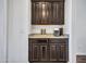 The coffee bar features granite countertops, dark cabinets, and a decorative backsplash at 4132 W Tunnel Mine Rd, New River, AZ 85087