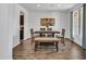 Inviting dining area is complete with wood floors, a table, and chairs at 4132 W Tunnel Mine Rd, New River, AZ 85087