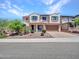Charming two-story home features a well-manicured yard and desert landscaping for pleasing curb appeal at 4132 W Tunnel Mine Rd, New River, AZ 85087