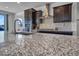 This kitchen features granite countertops, dark cabinets, and stainless steel appliances at 4132 W Tunnel Mine Rd, New River, AZ 85087