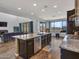 Open concept kitchen featuring granite counters, stainless appliances and dark wood cabinets at 4132 W Tunnel Mine Rd, New River, AZ 85087