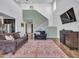 Spacious living area with high ceilings, stylish decor, and easy access to the kitchen and staircase at 4132 W Tunnel Mine Rd, New River, AZ 85087