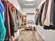 Bright walk-in closet with shelving and ample space for clothing and accessories at 4132 W Tunnel Mine Rd, New River, AZ 85087