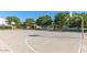 Outdoor basketball court surrounded by green trees and landscaping within the community at 4366 E Lexington Ave, Gilbert, AZ 85234