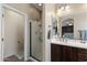 Bathroom featuring a glass-enclosed shower and vanity with storage space at 4366 E Lexington Ave, Gilbert, AZ 85234