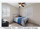 Cozy bedroom featuring a ceiling fan and plantation shutters at 4366 E Lexington Ave, Gilbert, AZ 85234