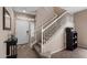 Welcoming entryway with a staircase, neutral paint, and a view of the front door with sidelights and transom window at 4366 E Lexington Ave, Gilbert, AZ 85234