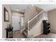 Inviting foyer featuring a staircase with white banisters and an abundance of natural light at 4366 E Lexington Ave, Gilbert, AZ 85234
