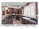 Well-equipped kitchen with dark wood cabinetry, stainless steel appliances, and ample counter space at 4366 E Lexington Ave, Gilbert, AZ 85234
