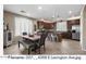Modern kitchen with stainless steel appliances, a central island, and a dining area at 4366 E Lexington Ave, Gilbert, AZ 85234
