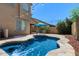 Beautiful pool and backyard featuring lush landscaping and charming string lights at 4366 E Lexington Ave, Gilbert, AZ 85234