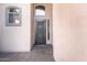 Close up view of the front door with security features and desert landscaping at 4493 E Desert Sands Dr, Chandler, AZ 85249