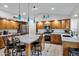 Open concept kitchen features granite counters, stainless steel appliances, and barstool seating at 4493 E Desert Sands Dr, Chandler, AZ 85249
