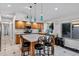 Spacious kitchen featuring a large island with bar seating and stainless steel appliances at 4493 E Desert Sands Dr, Chandler, AZ 85249