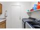 Modern laundry room with front-load washer and dryer at 4493 E Desert Sands Dr, Chandler, AZ 85249