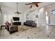 Spacious living room with vaulted ceilings, tile flooring, and comfortable furniture at 4493 E Desert Sands Dr, Chandler, AZ 85249