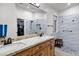 Modern main bathroom with dual sinks, granite counters, and a glass enclosed shower at 4493 E Desert Sands Dr, Chandler, AZ 85249