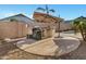 Outdoor grill and entertaining area features stainless steel built-in grill and umbrella at 4493 E Desert Sands Dr, Chandler, AZ 85249