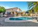 Backyard featuring a private pool, lounge chairs, and a covered patio area at 4493 E Desert Sands Dr, Chandler, AZ 85249