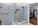 Stylish shower with stone tile flooring, glass surround and tiled walls at 4493 E Desert Sands Dr, Chandler, AZ 85249