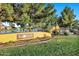 The Sun Groves community entrance sign is surrounded by a lush green lawn at 4493 E Desert Sands Dr, Chandler, AZ 85249