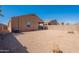 Spacious backyard features desert landscaping, creating a low-maintenance outdoor area at 5026 E Sunstone Dr, San Tan Valley, AZ 85143