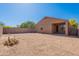 Large backyard with desert landscape offers space for outdoor activities and entertaining at 5026 E Sunstone Dr, San Tan Valley, AZ 85143