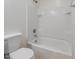 Bathroom featuring a white shower-tub combo and toilet at 5026 E Sunstone Dr, San Tan Valley, AZ 85143