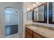Bathroom vanity with granite countertop connects to bedroom and shower at 5026 E Sunstone Dr, San Tan Valley, AZ 85143